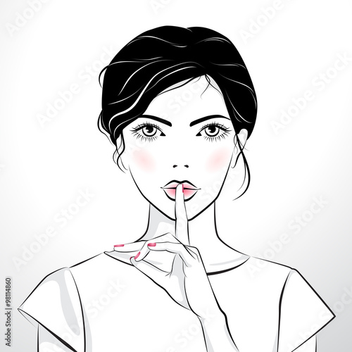 Beautiful girl with finger on her lips