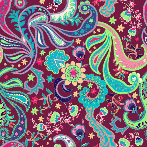 Paisley Seamless pattern with colorful flowers and leafs on red background.
