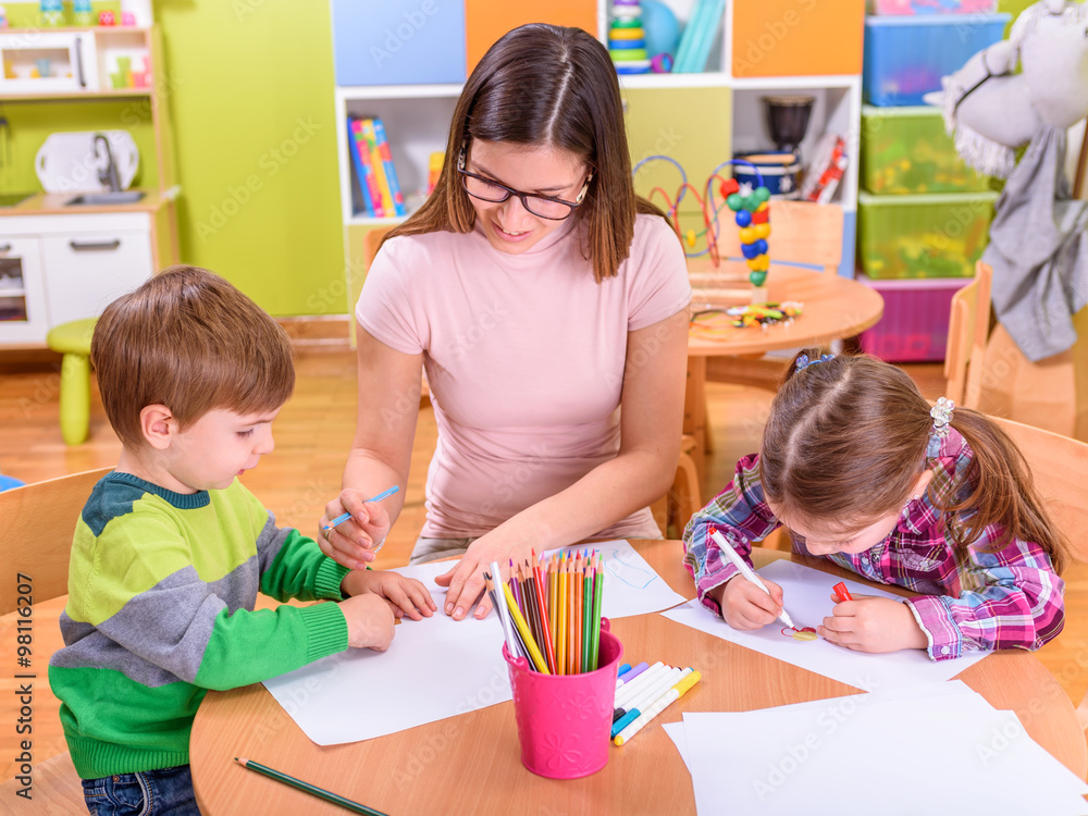 Fototapeta premium kindergarten classroom teacher with kids