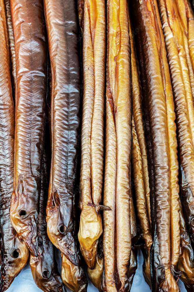 Obraz premium Fresh smoked eels / Fresh smoked eels ready to eat a traditional Dutch delicacy 