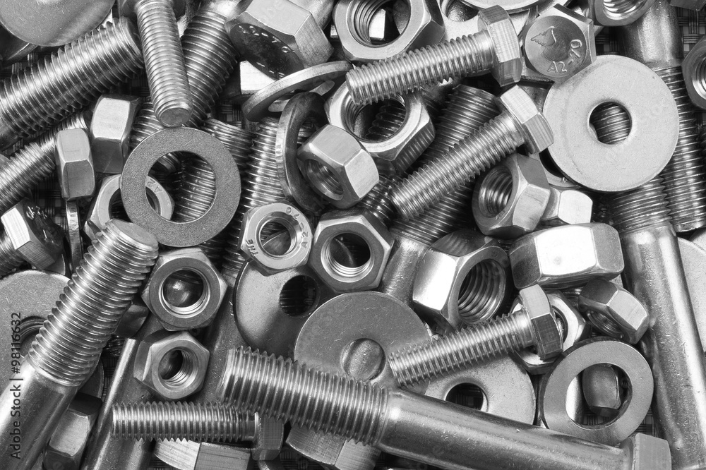 Mixture of stainless steel nuts bolts and washers / A mixture of