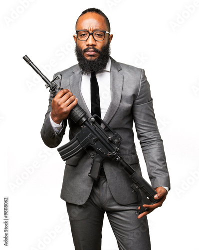 business black man holding a machine gun