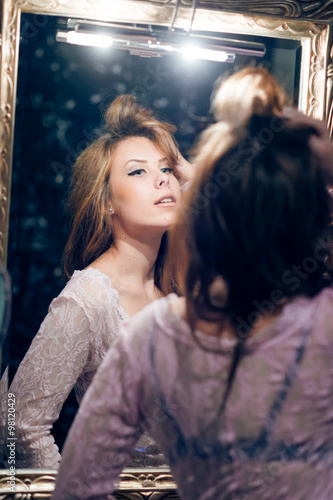 Picture of sensual beautiful young lady looking in mirror © gorosi