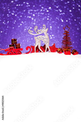 christmas ornament in snow on glitter background