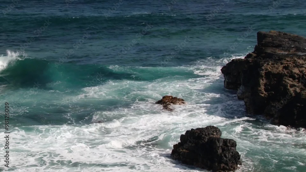 Indian ocean waves hit the black volcanic formation rocks at the famous shore of the Gris Gris in Souillac, Mauritius. Indian ocean waves hit the black volcanic formation rocks at the famous shore of the Gris Gris in Souillac, Mauritius.
