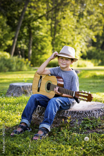 portrait of a little boy with guitar