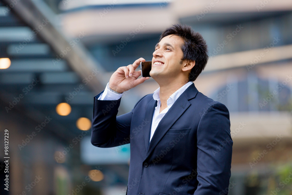 Portrait of confident businessman with mobile phone outdoors Portrait of confident businessman with mobile phone outdoors