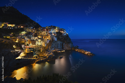Manarola night. Village, rocks and sea. Cinque Terre, Italy