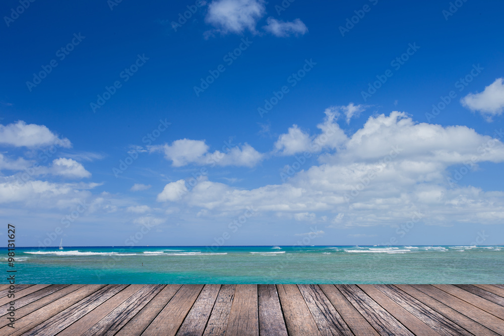 Wood floor with blurred sea background