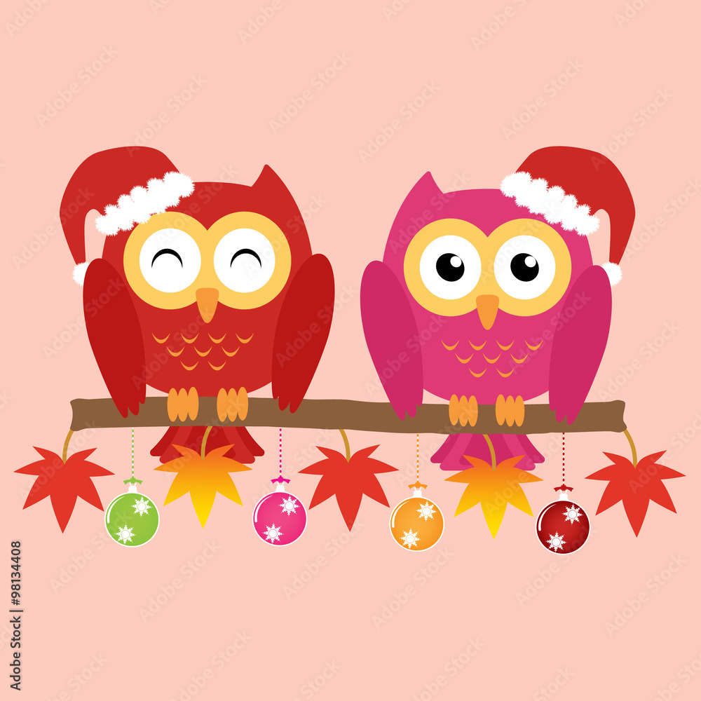 Fototapeta premium Two owls on maple tree wearing a red santa claus hat with christ