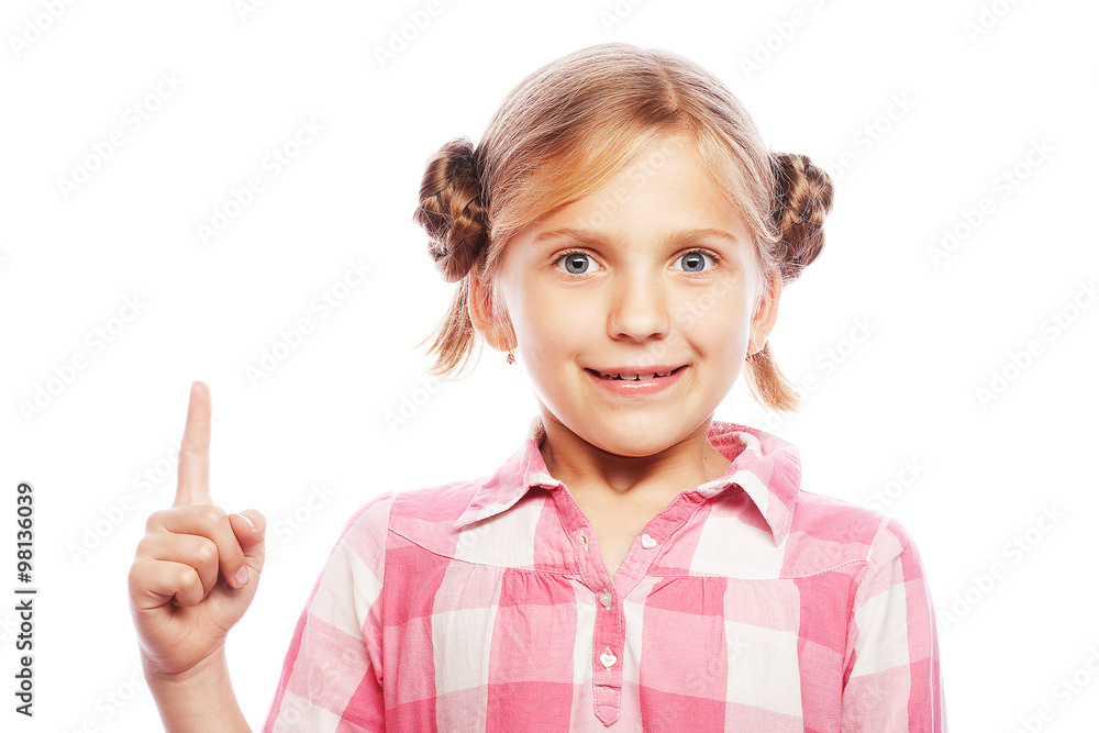 Pretty school girl pointing her index finger upwards in exciteme Pretty school girl pointing her index finger upwards in exciteme