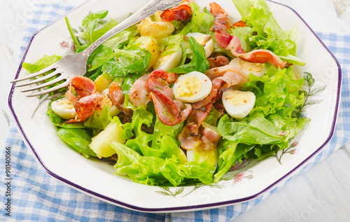 Warm salad with bacon, eggs and potatoes.
