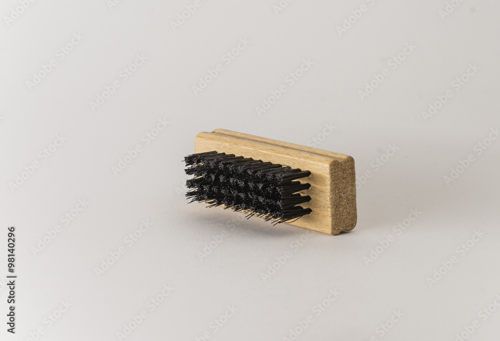 Brush for boots. Cleaning tool. Close up. Isolated on white background. Brush for boots. Cleaning tool. Close up. Isolated on white background.