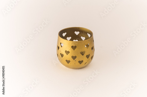 Golden candle holder. Hearths shapes.