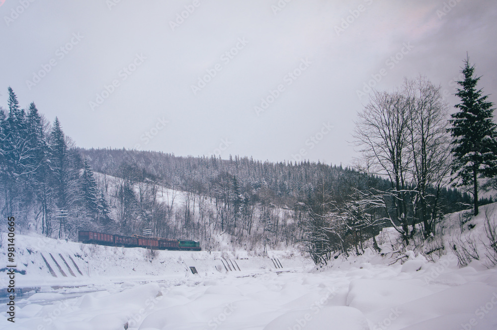 Mountain railway train car going through snowy mountains Mountain railway train car going through snowy mountains