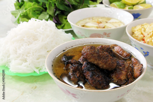 Bun cha, a Vietnamese dish of grilled pork and rice noodles served with fresh herbs and dipping sauce