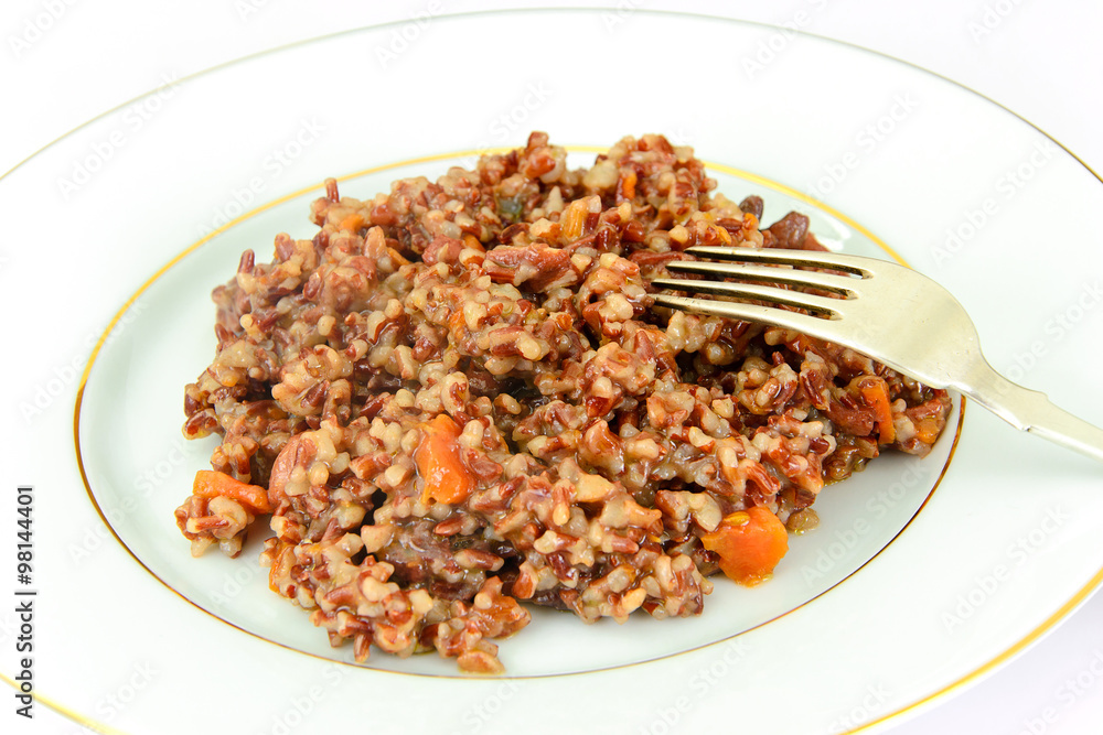 Fototapeta premium Healthy Food: Pilaf with Meat and Red Rice.