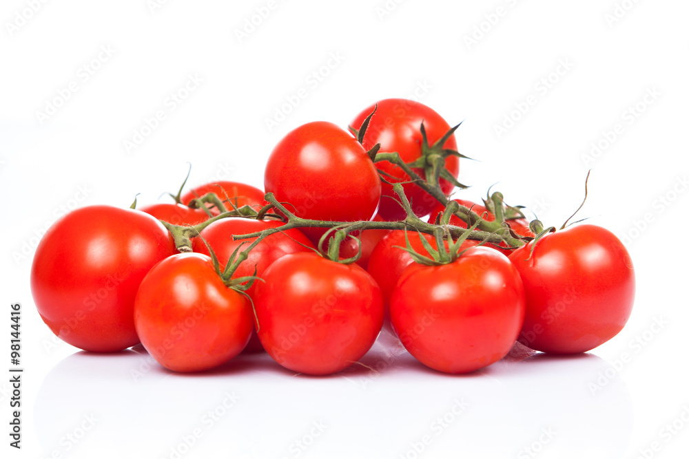 tomatoes on the vine isolated on white