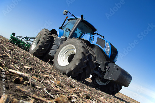 Modern tractor working in the field