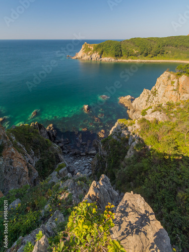 Скалы и горы на берегах Японского моря. Приморье, Россия. Rocks and mountains on the shores of the sea of Japan. Primorye, Russia.