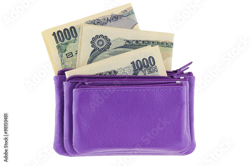 Purple multi layered leather zippered coin pouch with Japanese Yen banknote inside, isolated on white background photo