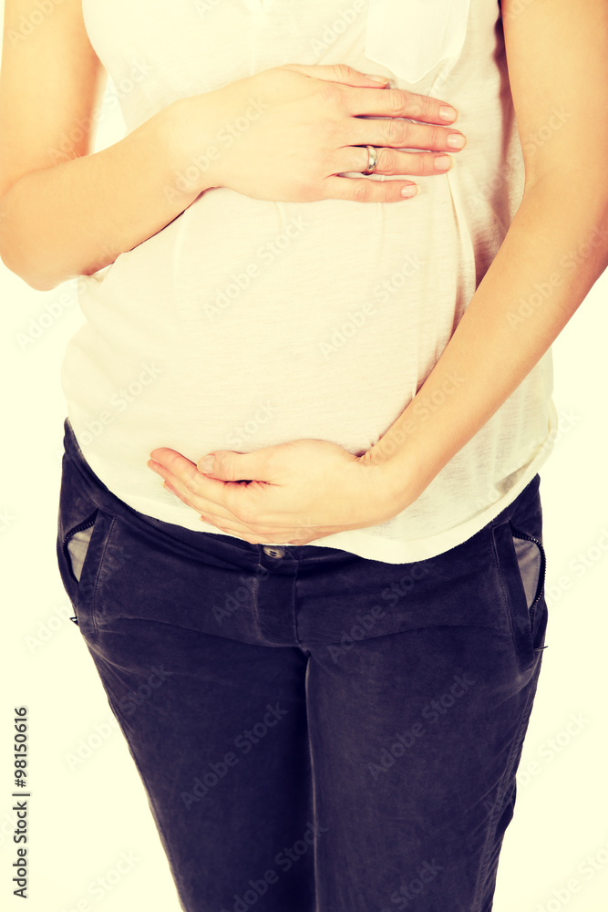 Pregnant woman holding her belly Pregnant woman holding her belly