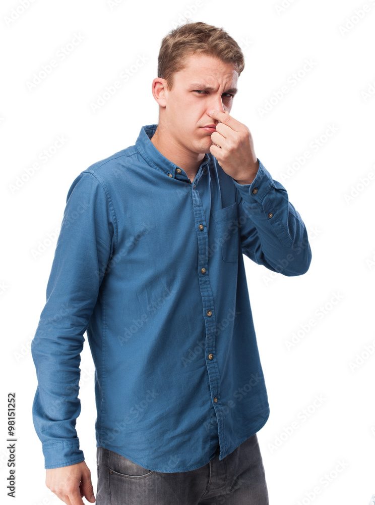 sad young-man smelling something sad young-man smelling something
