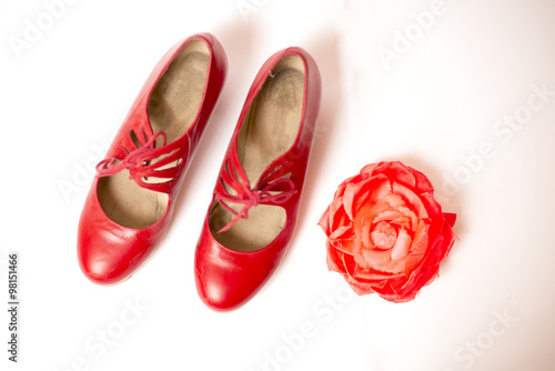 Red tango shoes on a white background