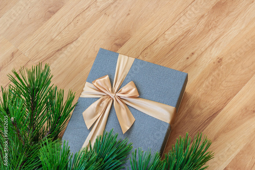 Present under christmas tree closeup view from above