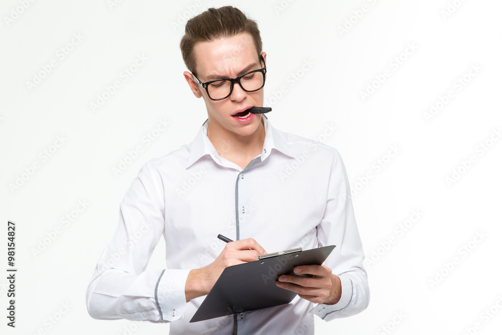 Businessman writing notes in clipboard