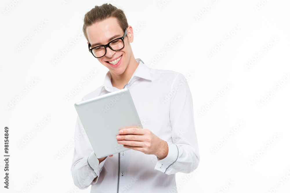 Smiling businessman using tablet computer Smiling businessman using tablet computer