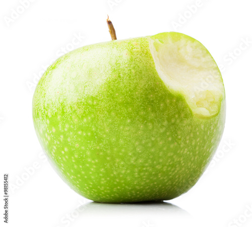 bitten green apple isolated on a white background photo