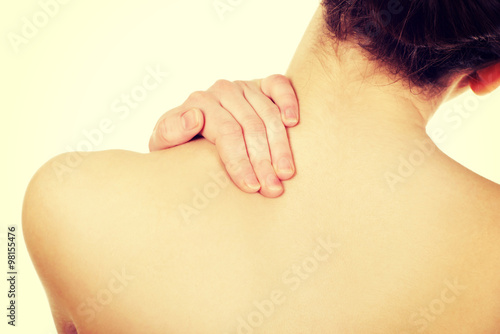 Woman holding her neck.