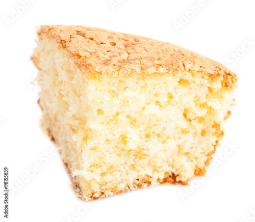 Fotografija one piece of sponge cake isolated on a white background