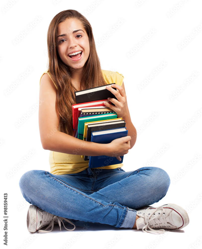 young woman sitting and hugging a books pile young woman sitting and hugging a books pile