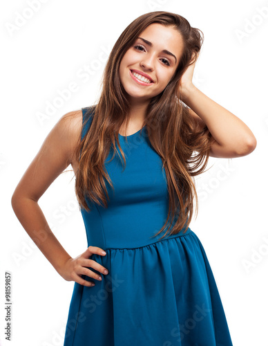 pretty young girl wearing a blue dress isolated on a white backg © asierromero
