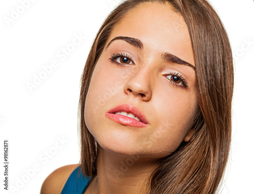 young pretty woman face closeup on white background