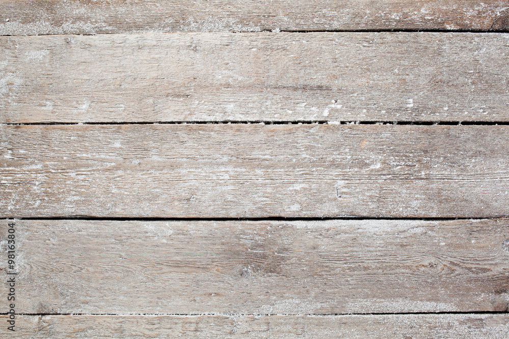 Fototapeta premium Christmas background with falling snow over wooden background