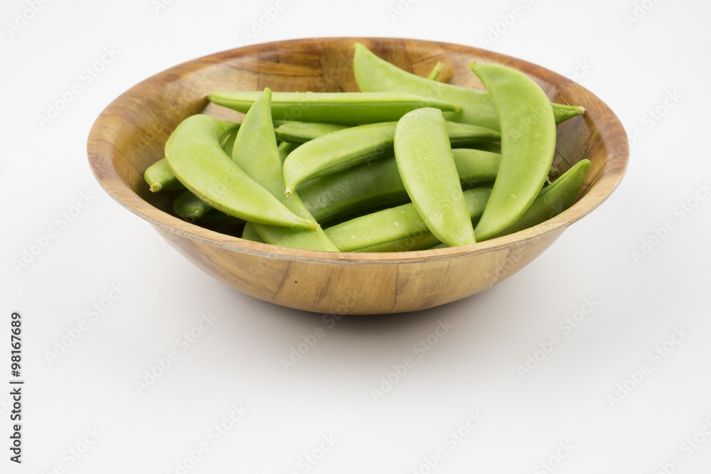Green peas in bowl on white background. Selective focus Green peas in bowl on white background. Selective focus