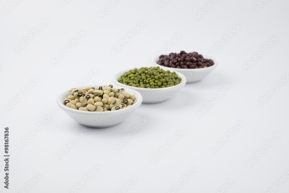 Black eye peas, mung bean and adzuki beans in white bowl on white background Black eye peas, mung bean and adzuki beans in white bowl on white background
