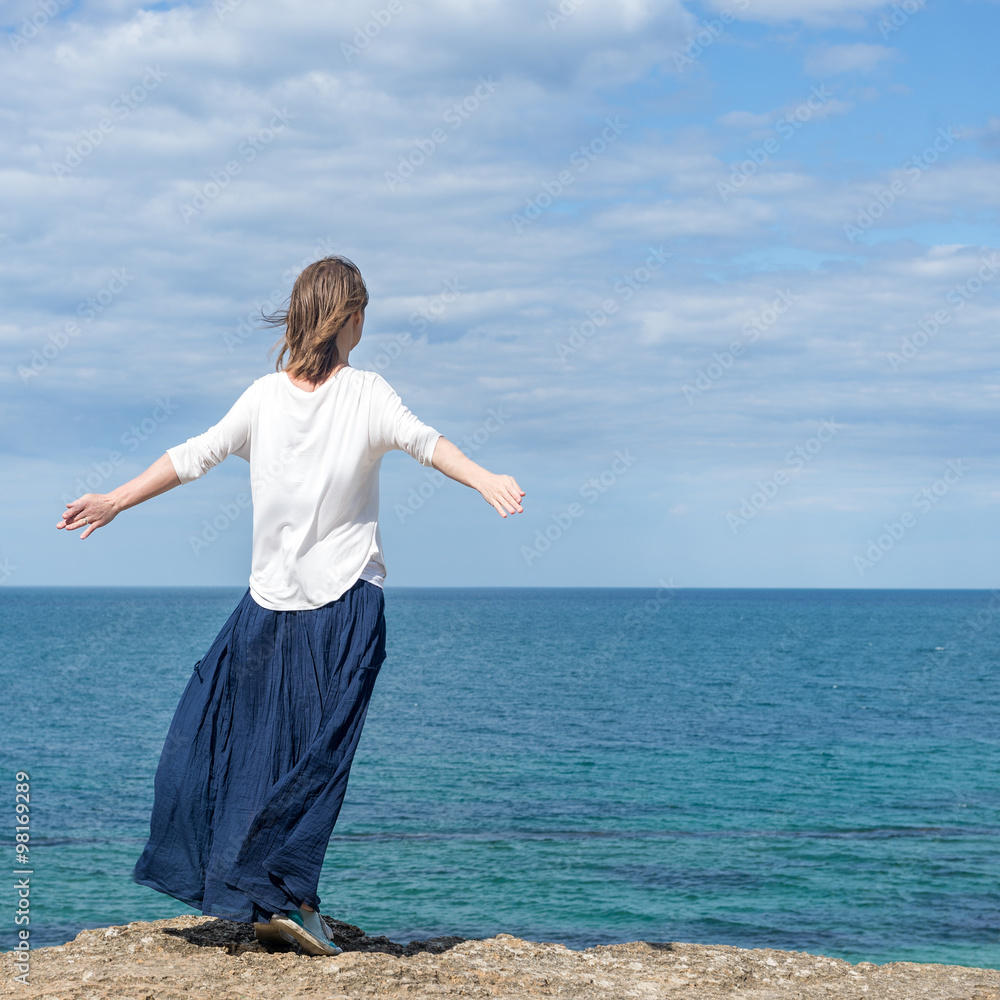 Woman standing at the beach