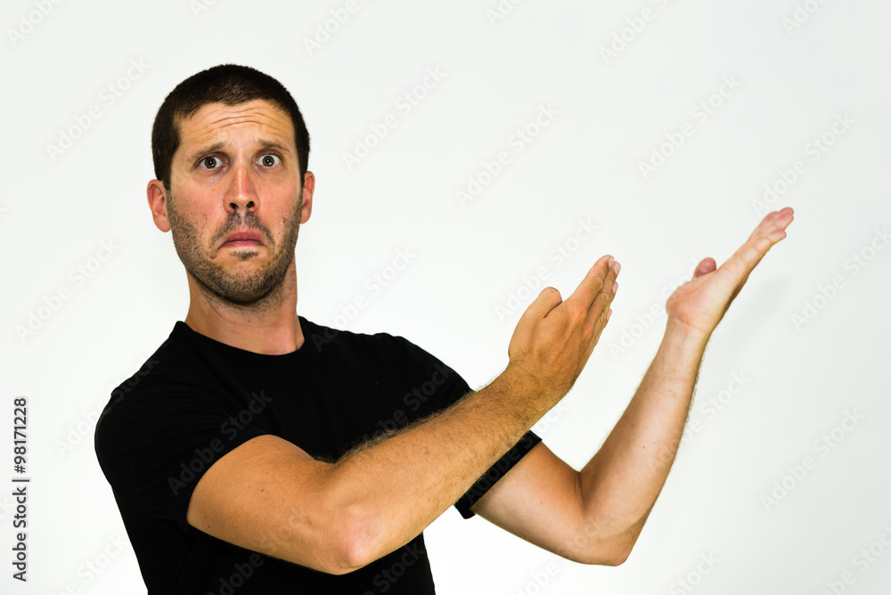 close up of amazed young caucasian man pointing to the side - isolated on white background with copyspace close up of amazed young caucasian man pointing to the side - isolated on white background with copyspace