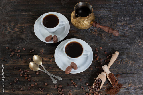 coffee cup background with coffee beans and chocolate candies