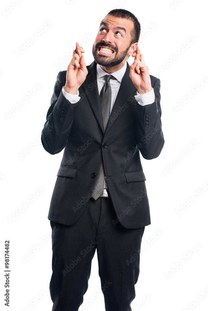 Businessman with his fingers crossing Businessman with his fingers crossing