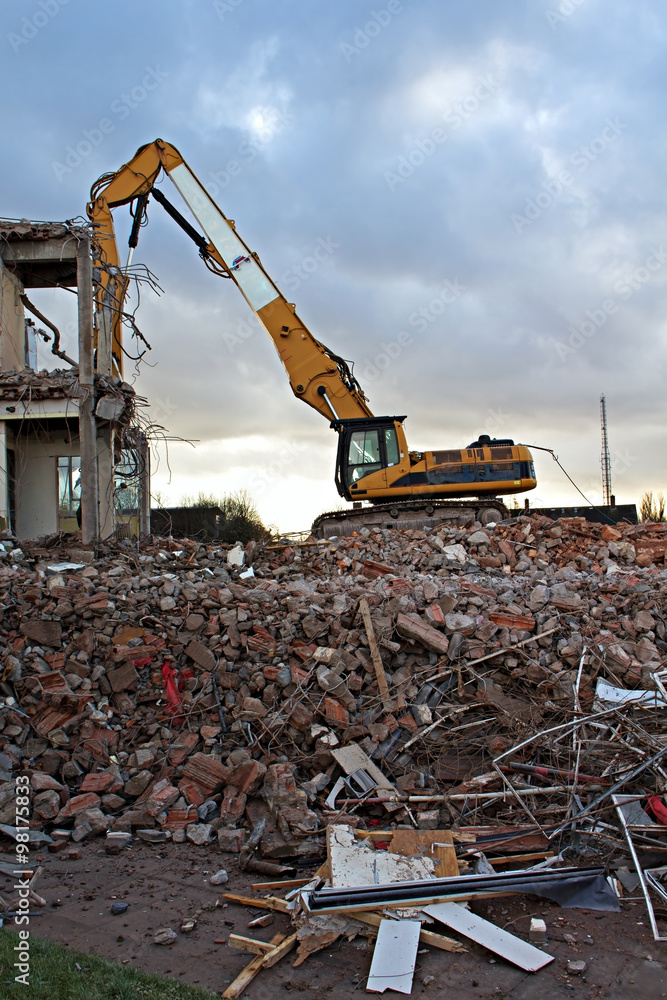 Fototapeta premium Construction Site Excavator Dismantling a Building