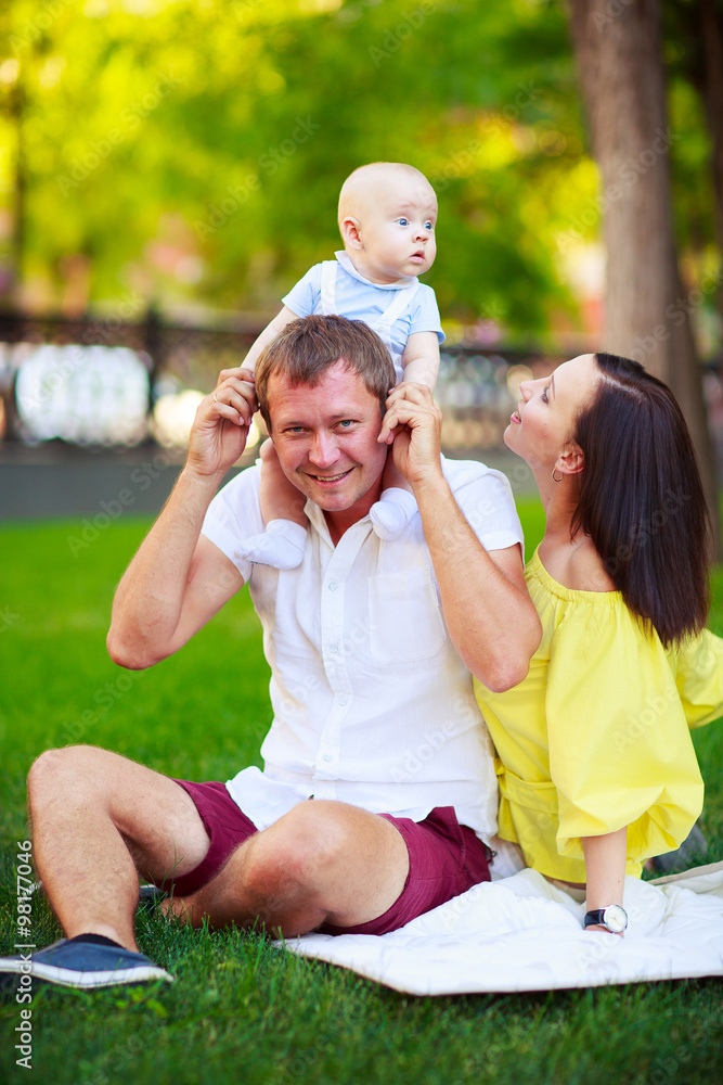 Fototapeta premium Portrait of a father, mother and baby
