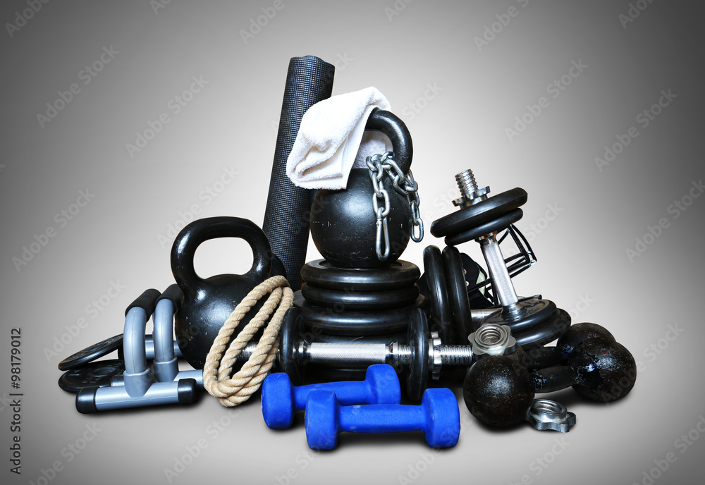 Sports equipment for bodybuilding collected in a heap Sports equipment for bodybuilding collected in a heap