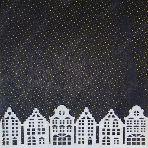 Photography Paper cut-out white houses on dark spotted background