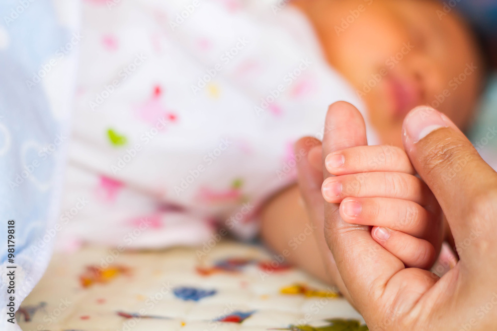 Small delicate little hand of newborn - close portrait Small delicate little hand of newborn - close portrait