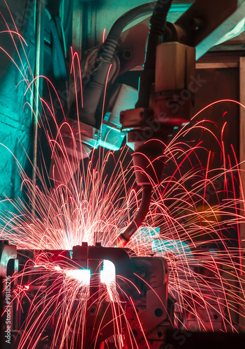 Welding robots movement in a car factory